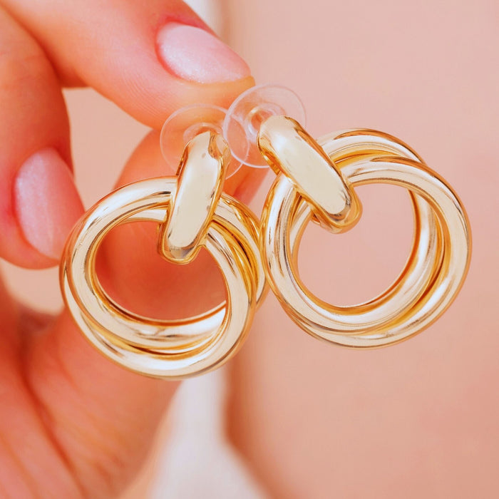 Gold Love Knot Geometric Drop Earrings – Bold, Modern & Eye-Catching
