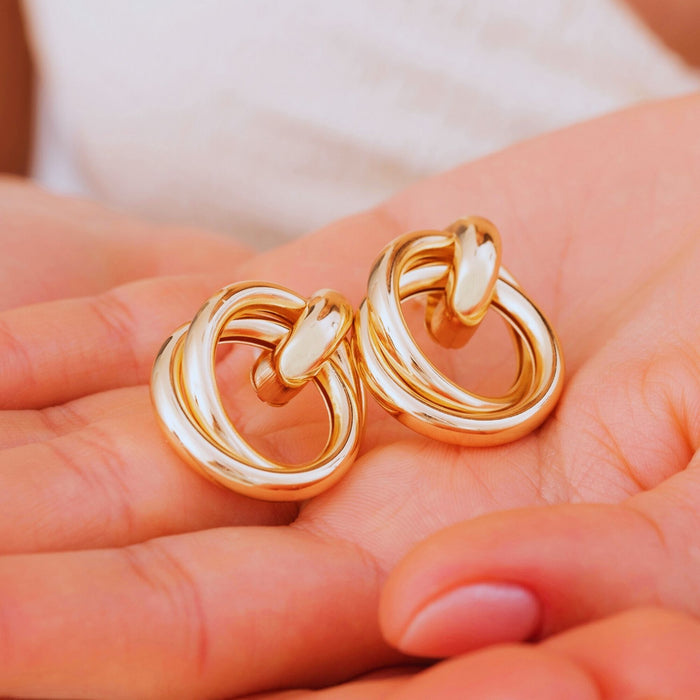 Gold Love Knot Geometric Drop Earrings – Bold, Modern & Eye-Catching